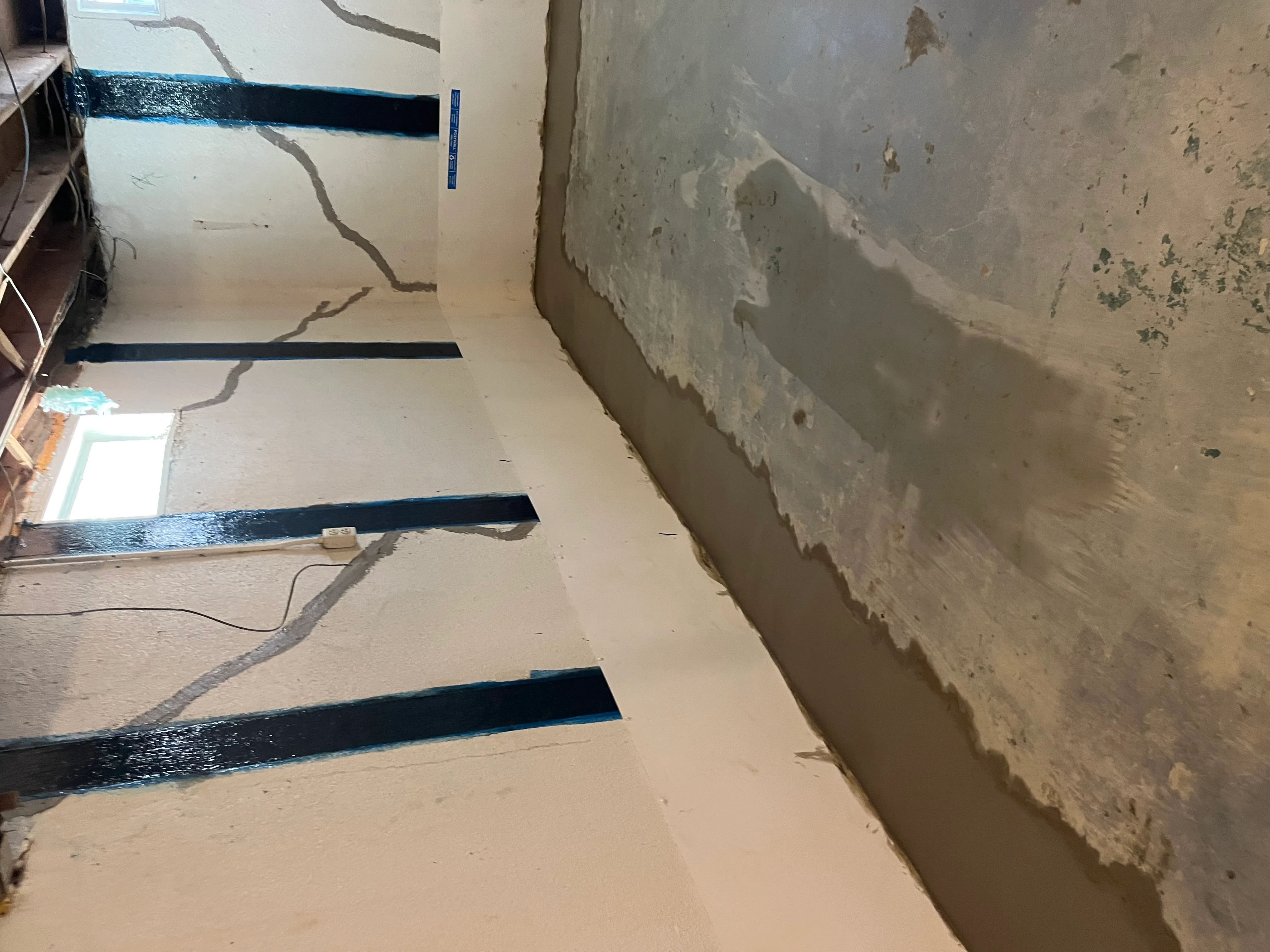Foundation crack waterproofing and repair on basement wall