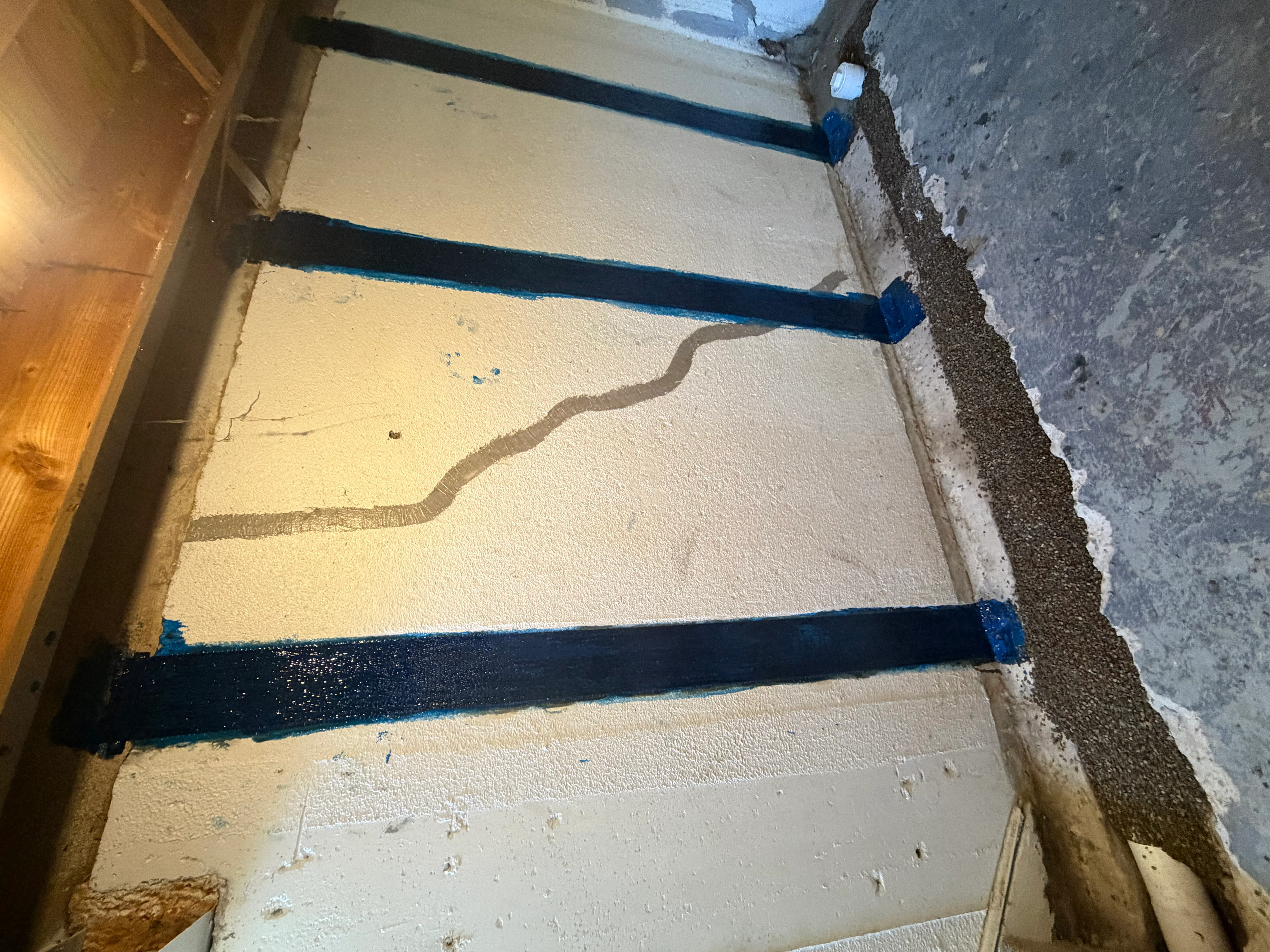 Interior foundation waterproofing with blue drainage system